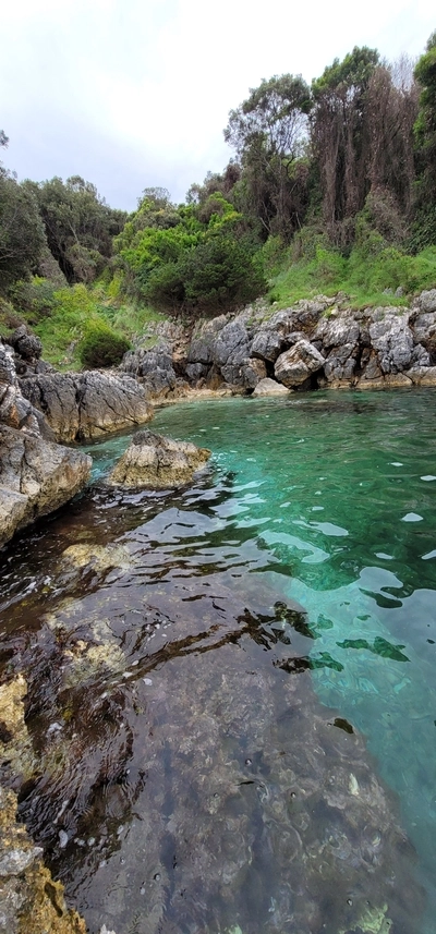 Secluded beach with crystal-clear water in Ksamil, Albania